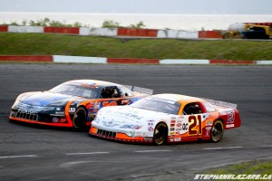 Serie ACT title favorites Jean-Francois Dery (21QC) and Dany Trepanier (19QC) battle at Circuit Riverside Speedway in St Croix, QC in 2012.  Serie ACT will begin the 2013 season this Saturday, June 8 at Circuit Riverside Speedway. (Photo Credit: Stephane Lazare)