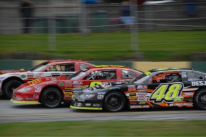 Alex Labbe (48QC) battles his way to a third place finish in the 2013 Milk Bowl at Thunder Road. (Photo by Steve Poulin)
