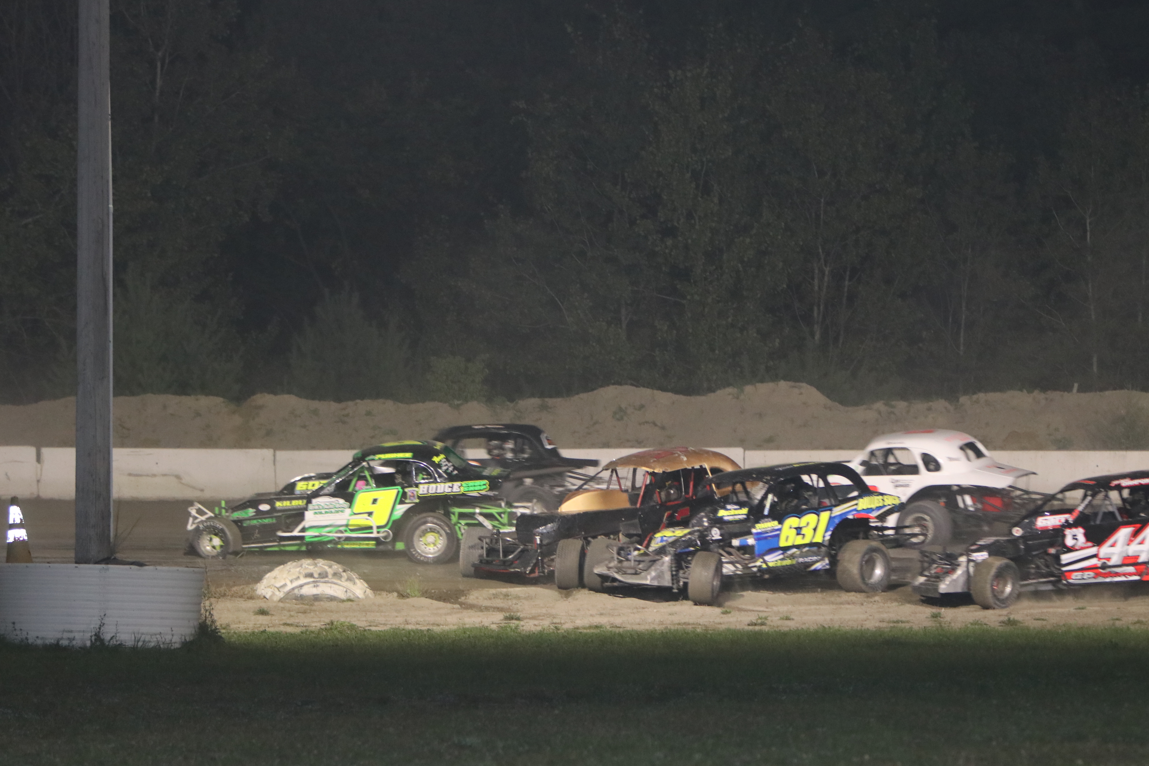 BRS_AW_9-12_a_pile_of_DIRTcar_Sportsman_Coupes_in_turn_two.JPG